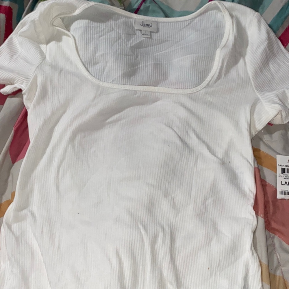 never used before low cut white body suit.